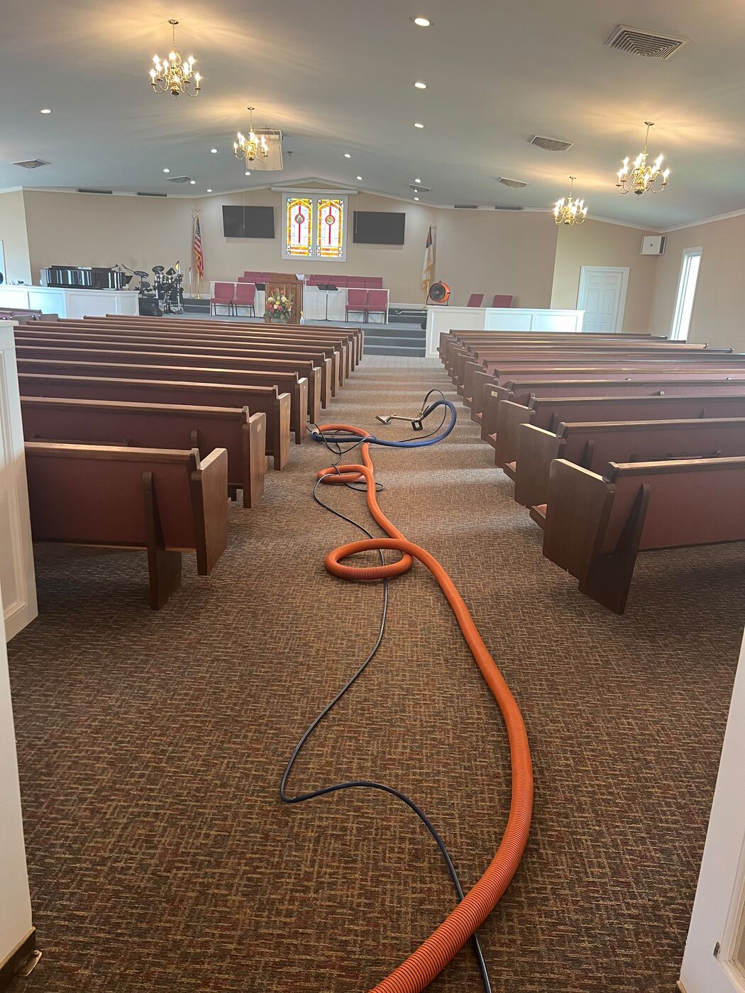 Sanctuary carpet and pew cleaning, aisle view