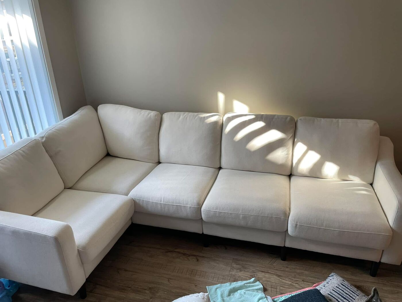 Freshly cleaned white sectional sofa